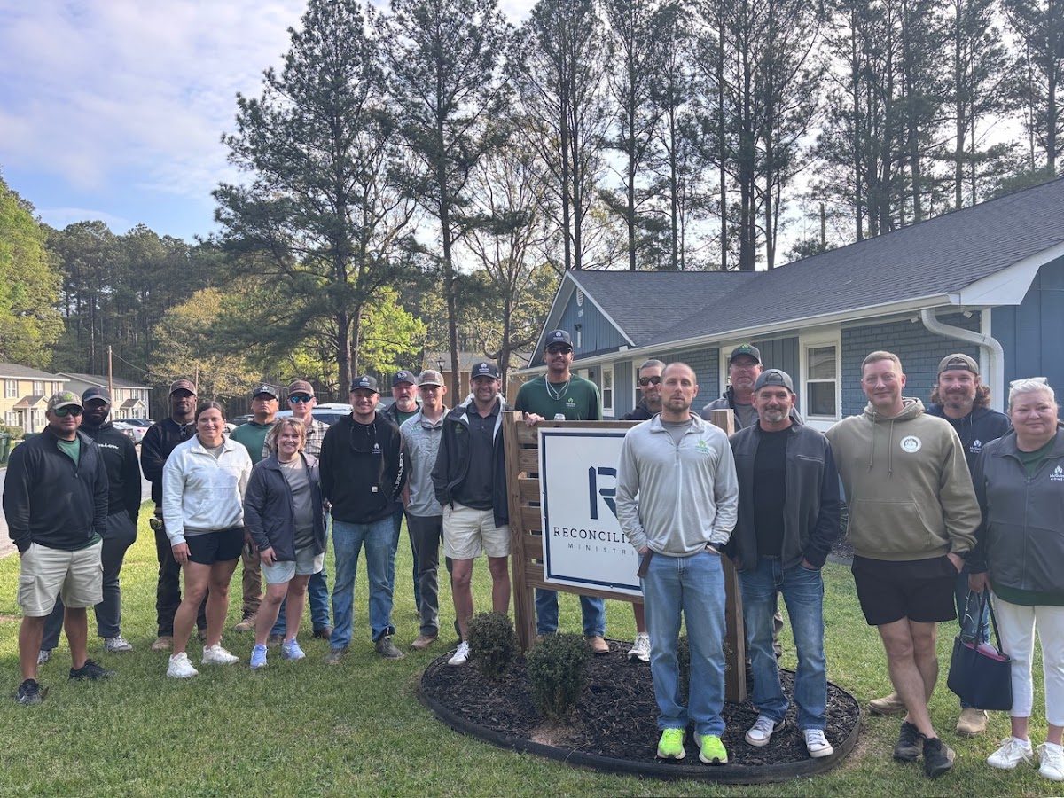 A McGuinn Homes serve team on campus